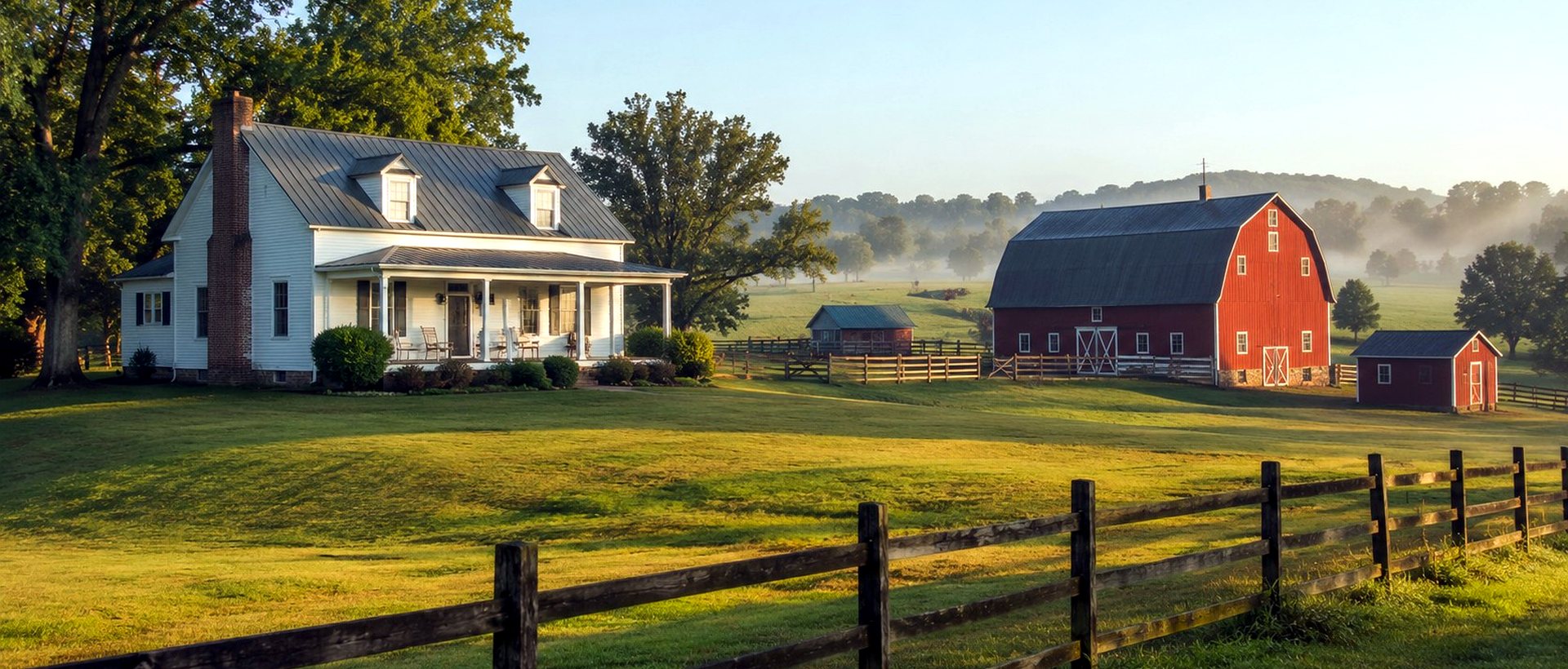 A white farmhouse and red barn on rolling Piedmont farmland
